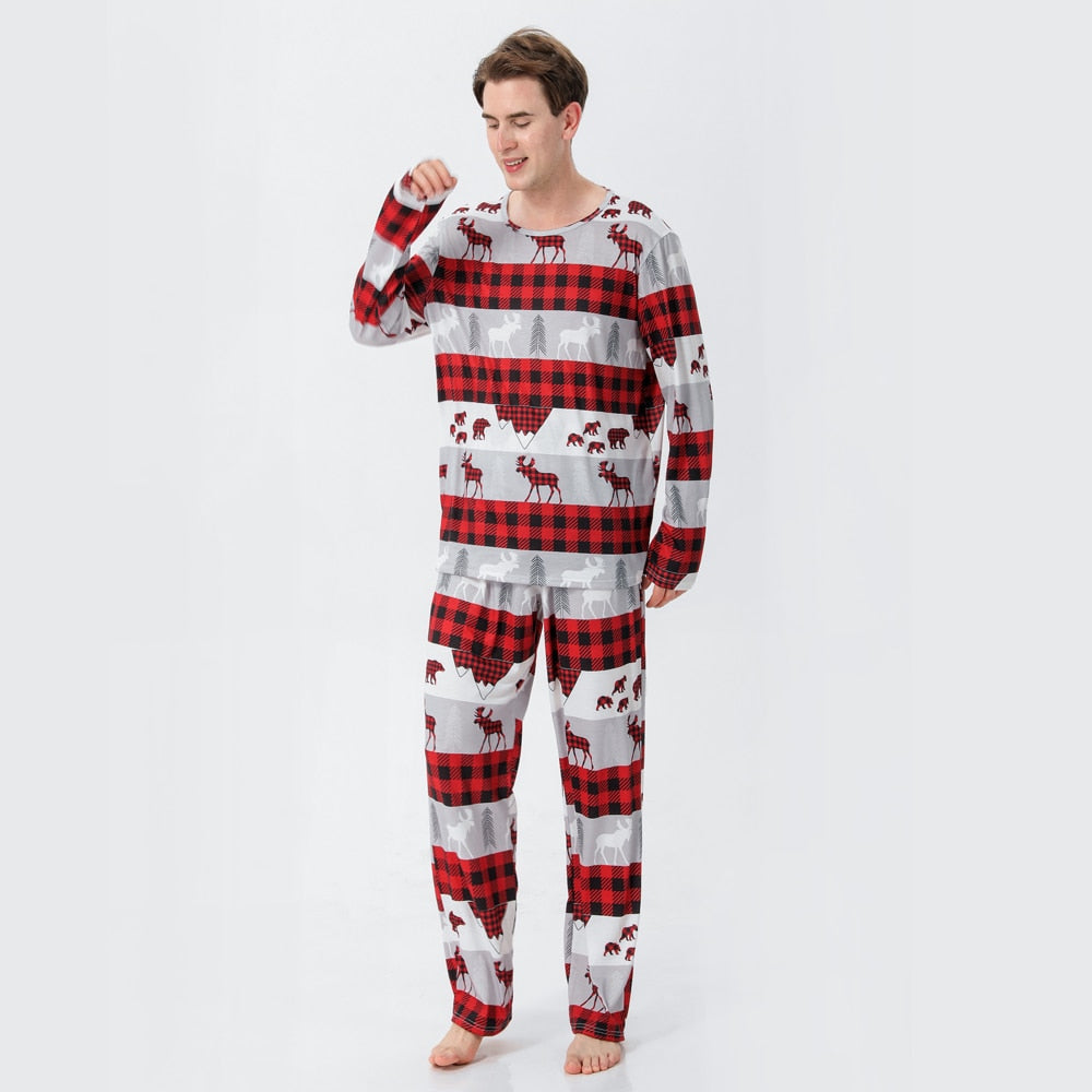 Happy family wearing matching Christmas pajamas, cozy holiday sleepwear set, perfect family gift
