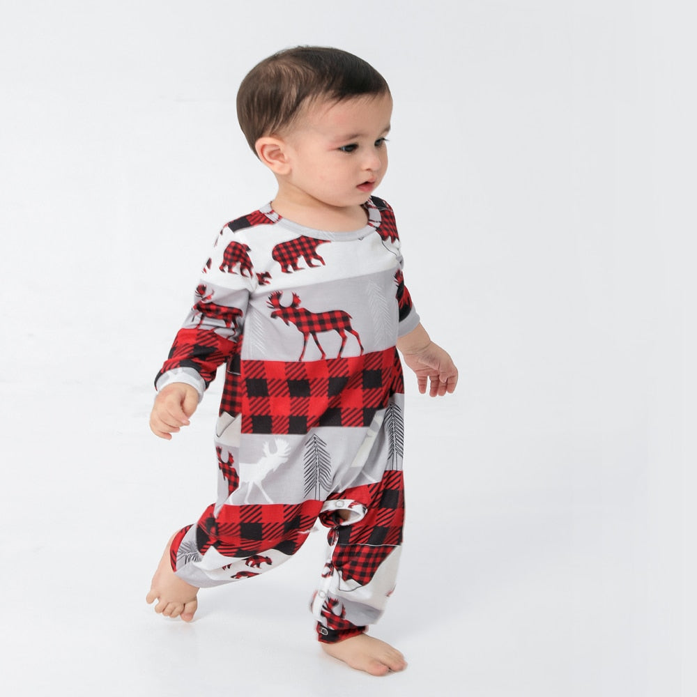 Toddler and dog in matching Christmas pajamas, adorable festive sleepwear, cozy winter holiday set