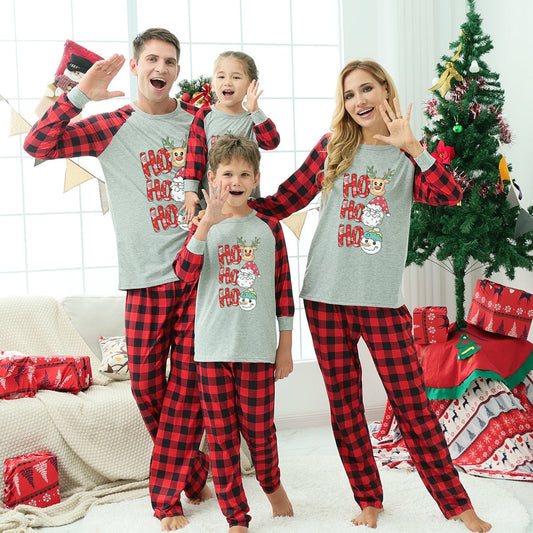 Family matching Christmas pajamas set with funny reindeer print for festive holiday wear.