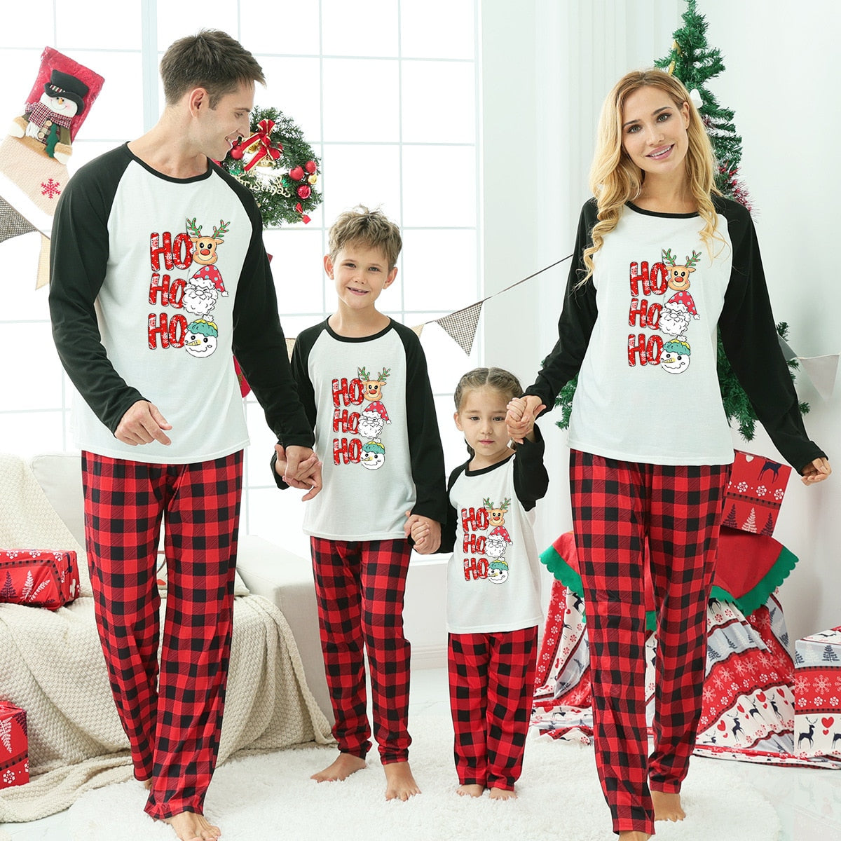 Unisex family Christmas loungewear set featuring a humorous Santa design on red polyester fabric.