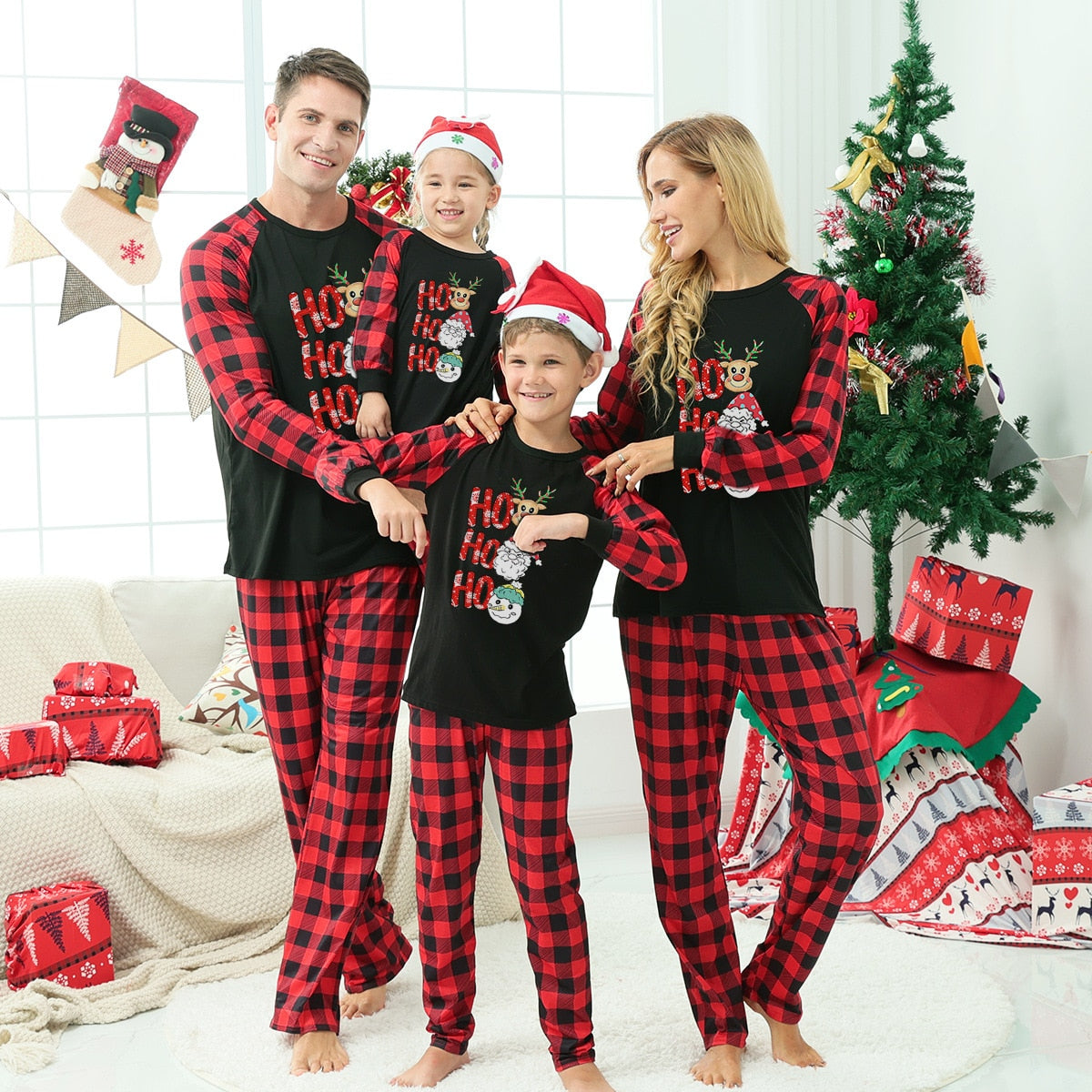 Family matching holiday wear set, polyester pajamas with funny Christmas tree designs for all ages.