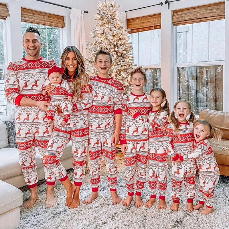 Family matching Christmas pajamas set with 'Merry Christmas' print, cozy cotton fabric, perfect for holiday photos