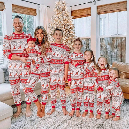Family matching Christmas pajamas set with 'Merry Christmas' print, cozy cotton fabric, perfect for holiday photos