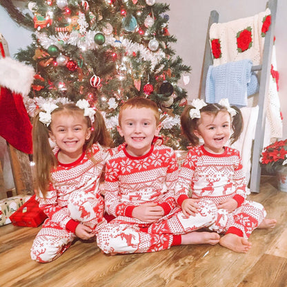 Soft cotton family matching Christmas pajamas set featuring a reindeer pattern, perfect for festive winter nights