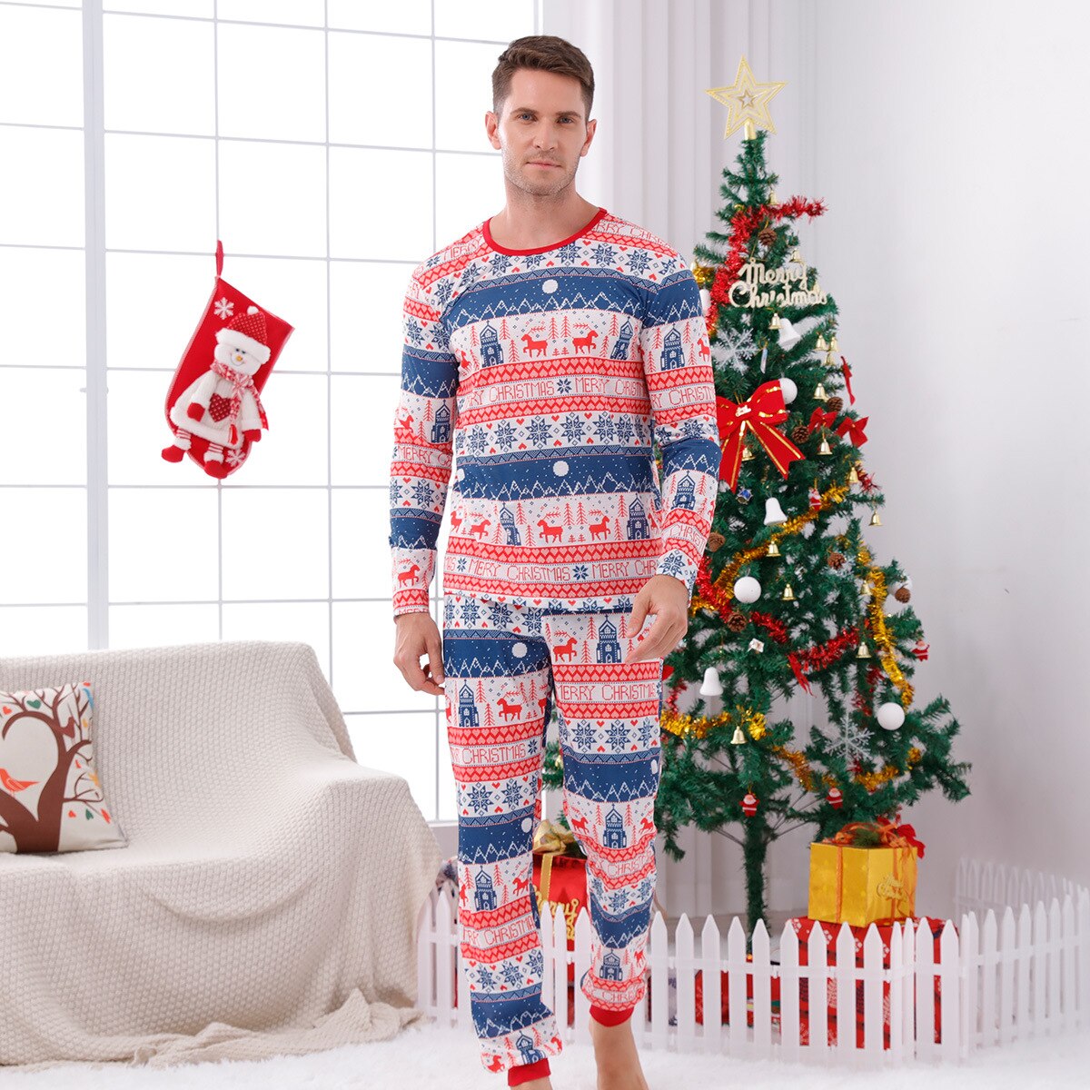 Parents and child wearing matching 'Believe' print Christmas pajama sets, cozy family sleepwear