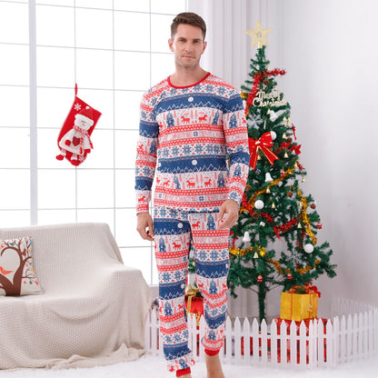 Parents and child wearing matching 'Believe' print Christmas pajama sets, cozy family sleepwear