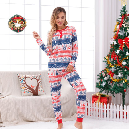 Family posing together in festive 'Celebrate' print matching Christmas pajamas, comfortable sleepwear