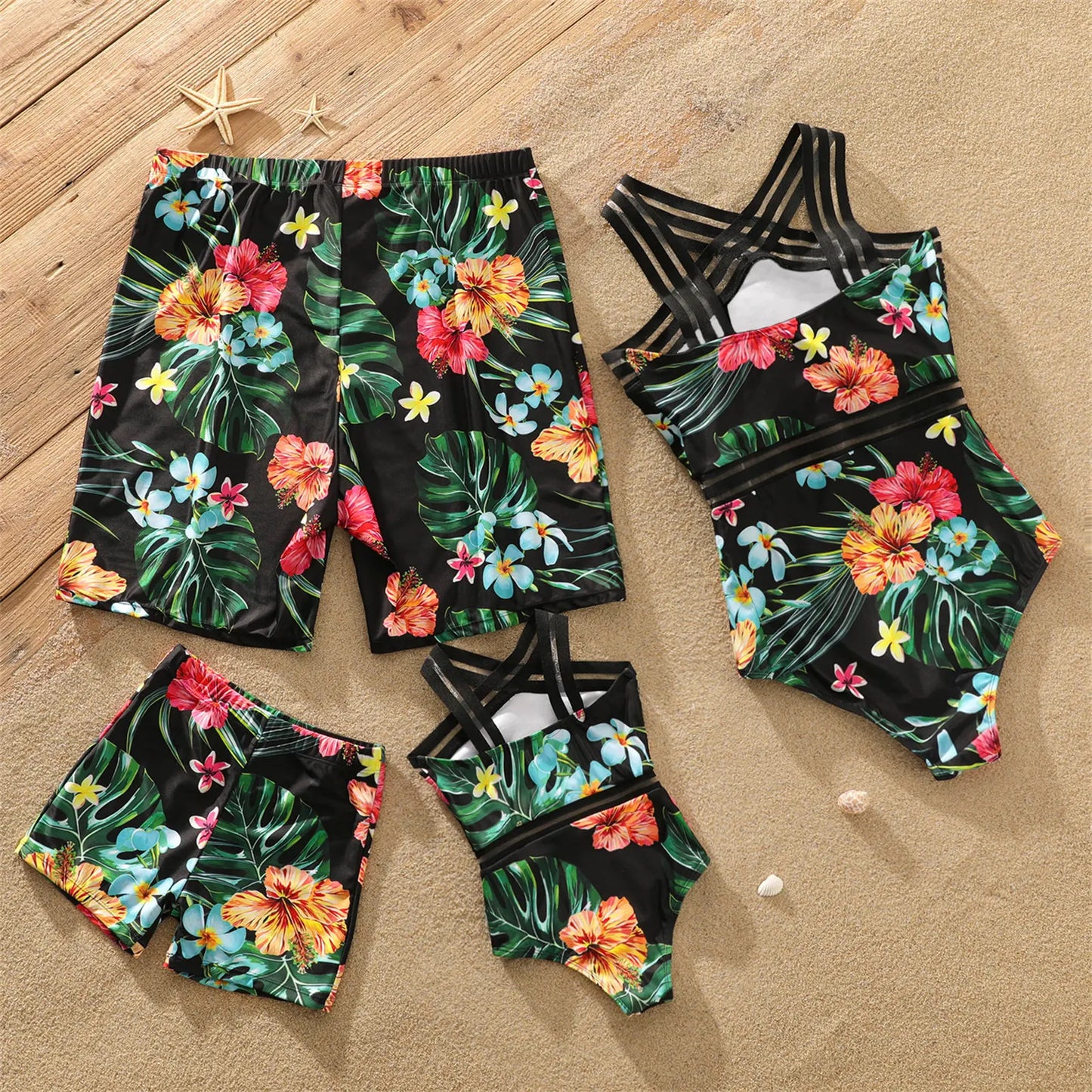 Matching mother and daughter coconut tree print swimsuits, perfect for family beachwear and summer style.