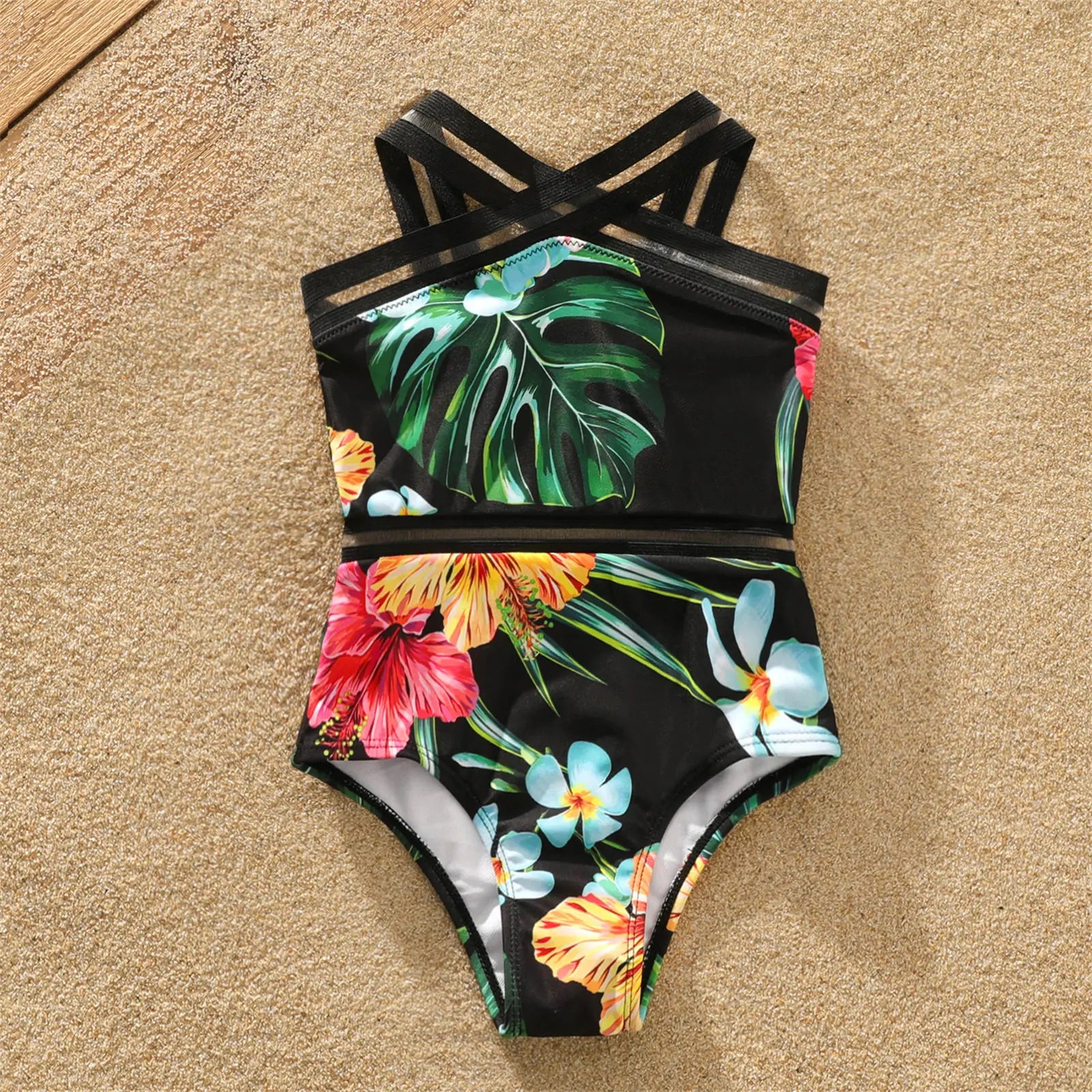 Matching men's swimming trunks with coconut tree print for dad, perfect for family beach adventures.