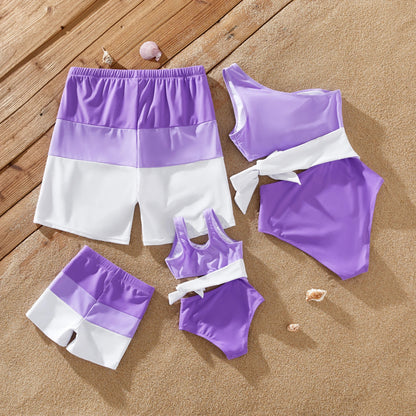 Mom and daughter in one-shoulder color-block swimsuits, quick-dry fabric
