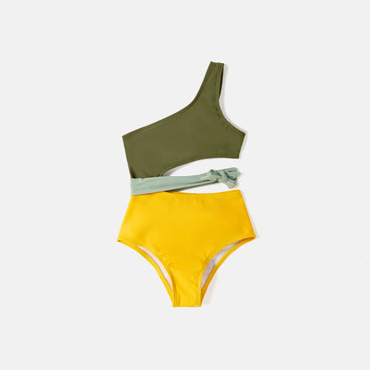 Family wearing matching colorblock swimwear, one-shoulder swimsuit & swim trunks, enjoying vacation
