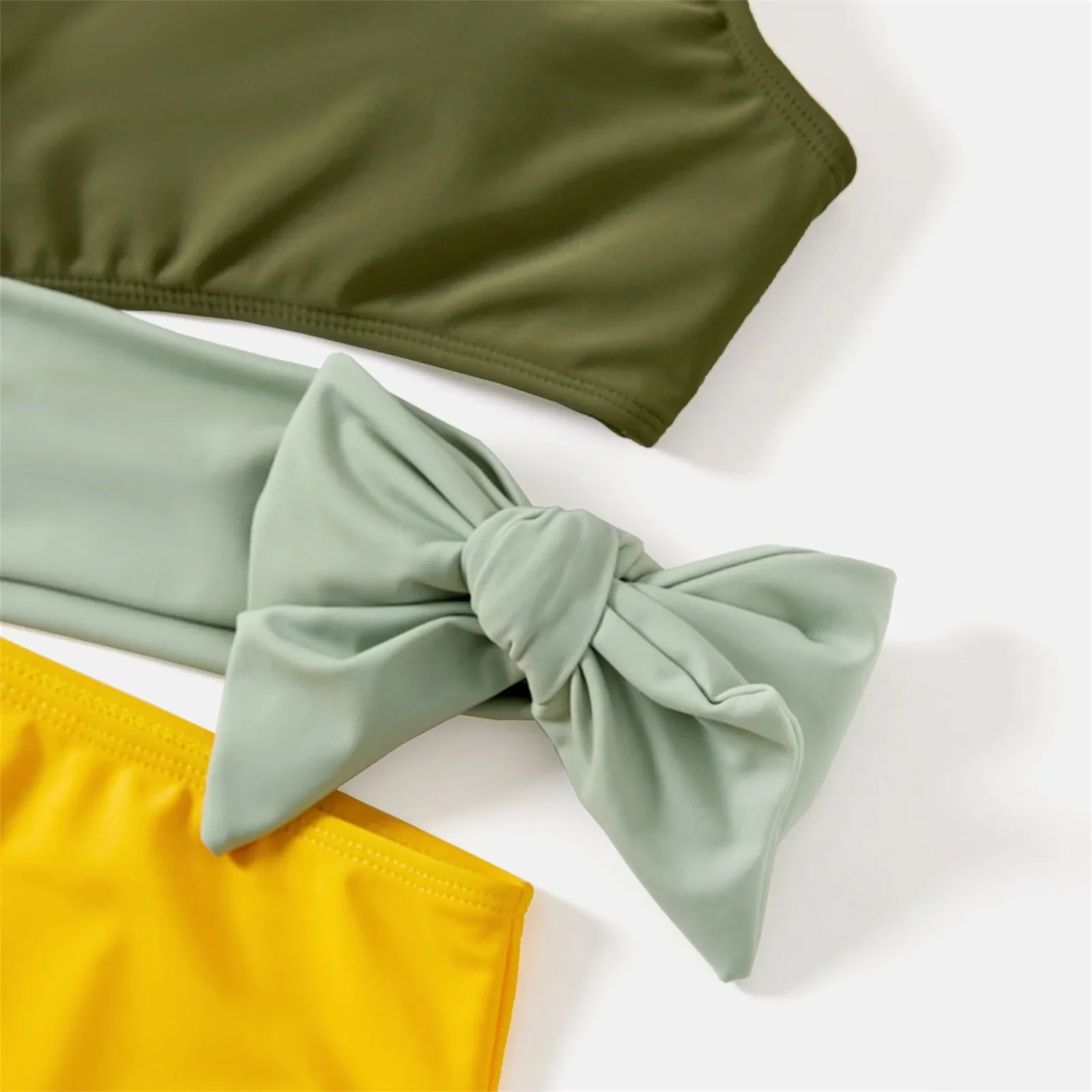 Stylish family matching colorblock swimwear set, perfect for beach or pool on vacation
