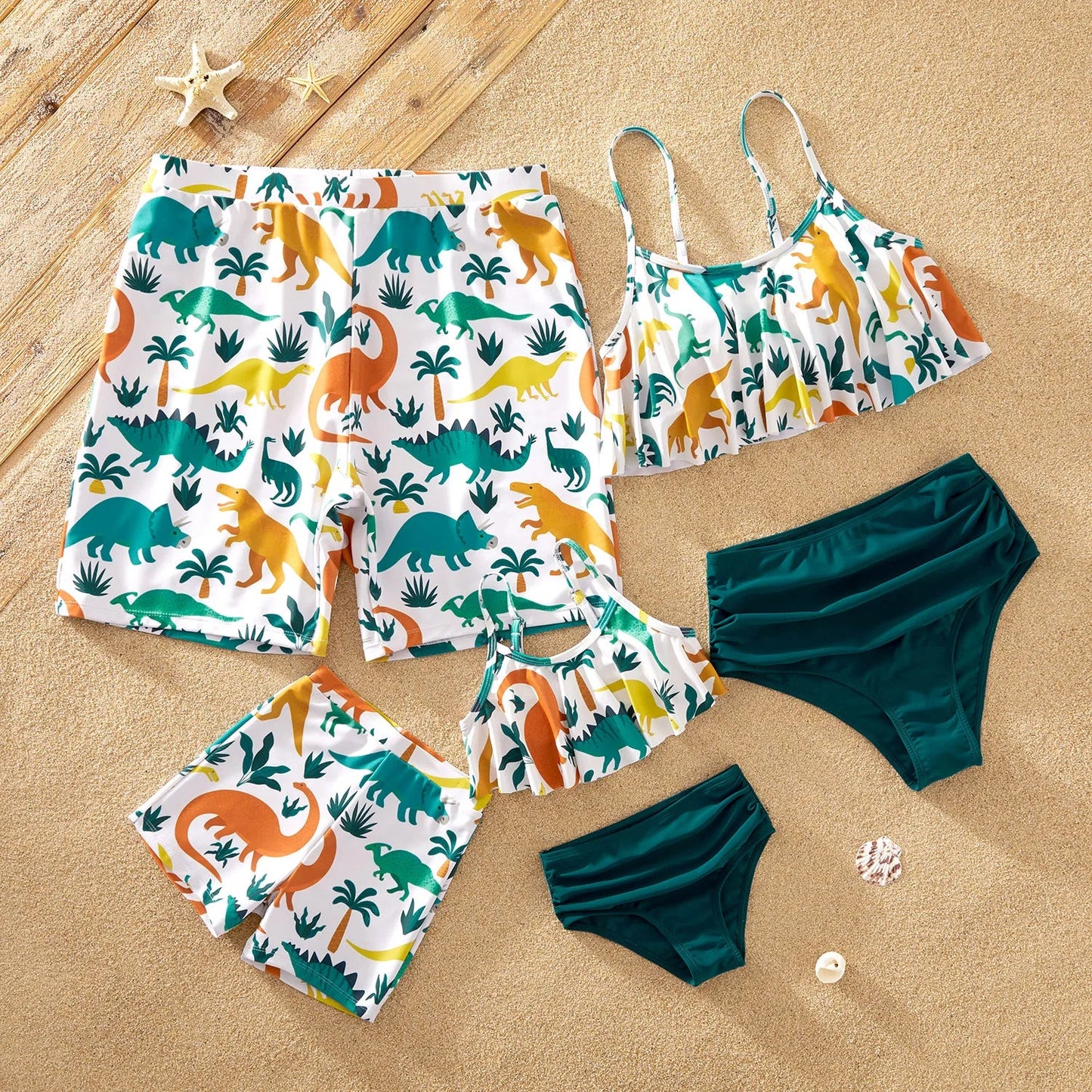 Family matching dinosaur print swimsuits, blue, for beach & pool fun, made of polyester spandex.