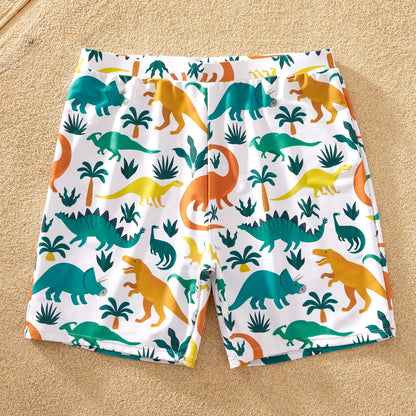 Babies' blue dinosaur print rash guard & swim trunks set, cute and protective for pool play.