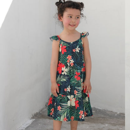 Baby in a cute floral print romper, part of a family matching set, made from soft cotton