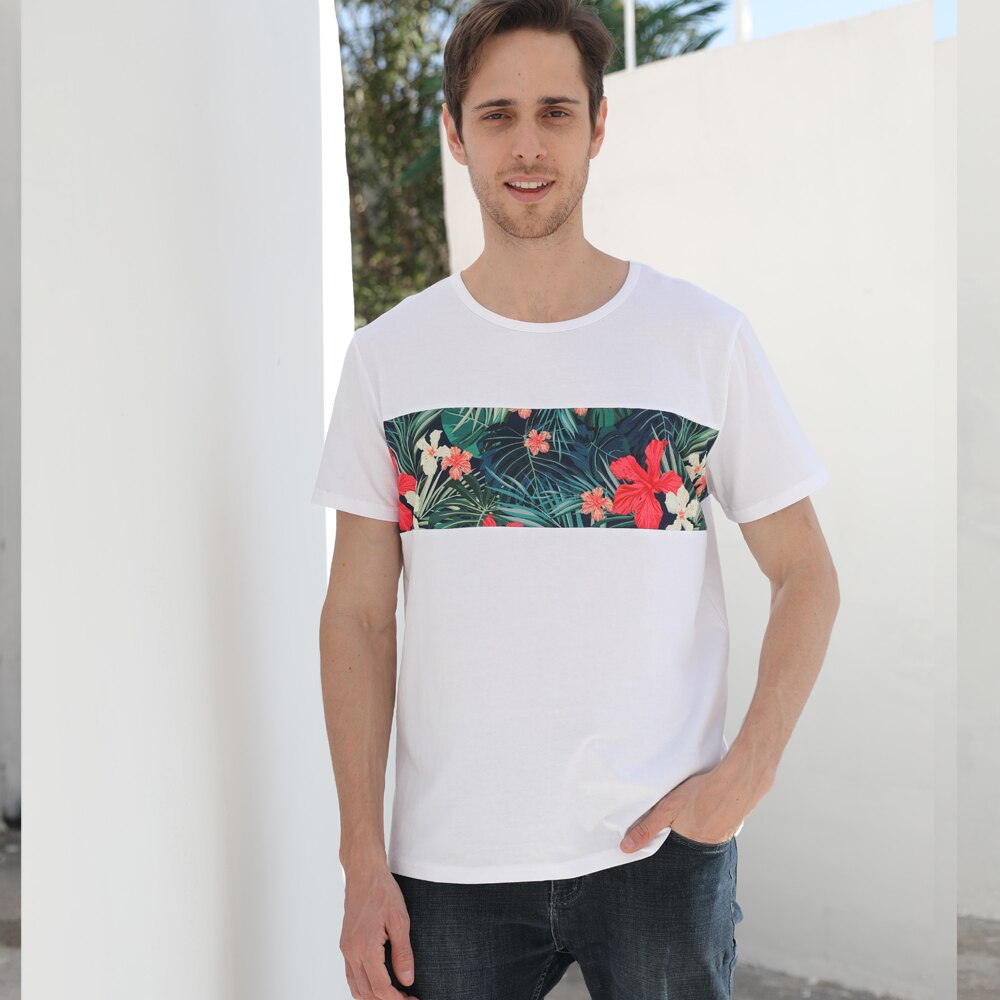 Stylish women's floral sundress and a men's casual floral shirt for summer travel