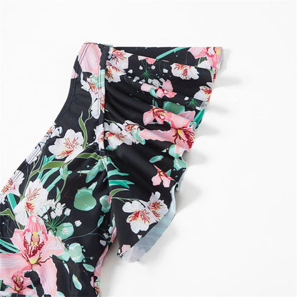 Floral print textile detail from family swimsuits, highlighting summer vacation style.