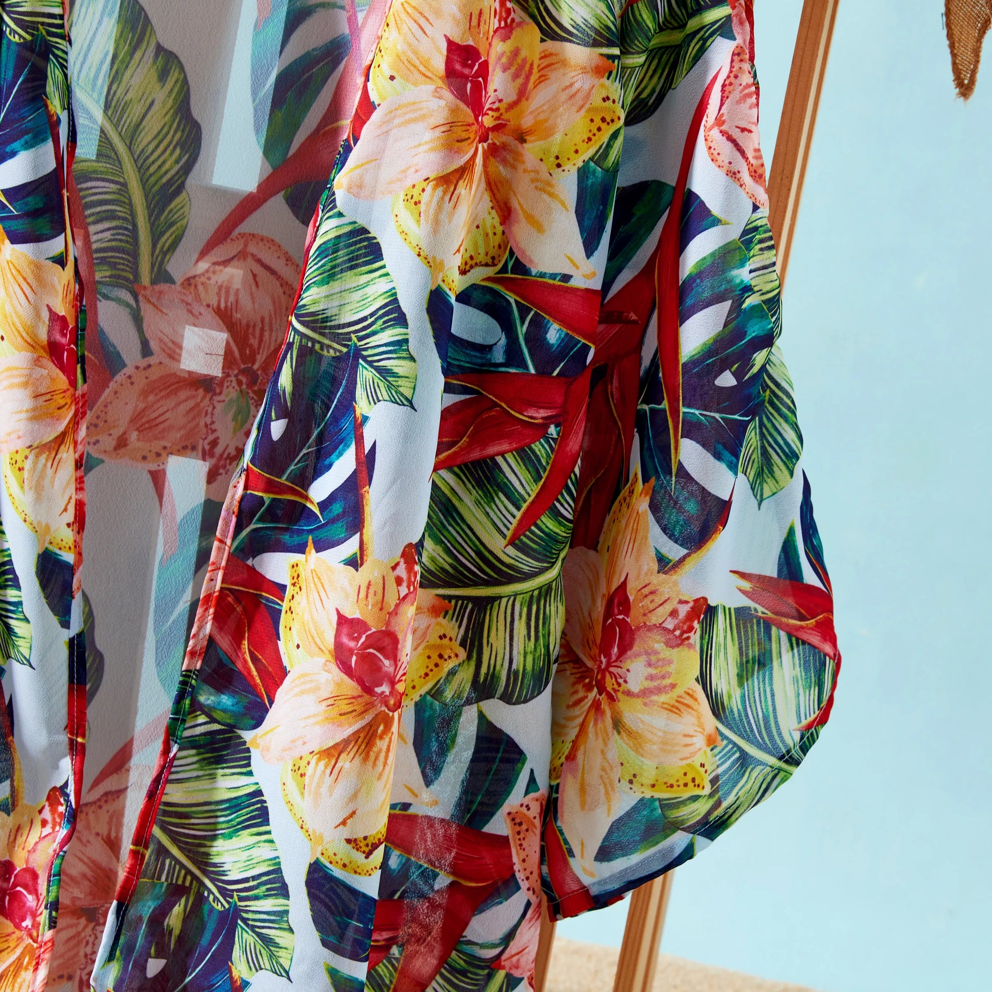 Kid's red floral rash guard, protection and style for summer fun.