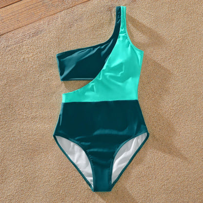 Green one-shoulder swimsuit with ruffles for girl, matching striped swim trunks for boy