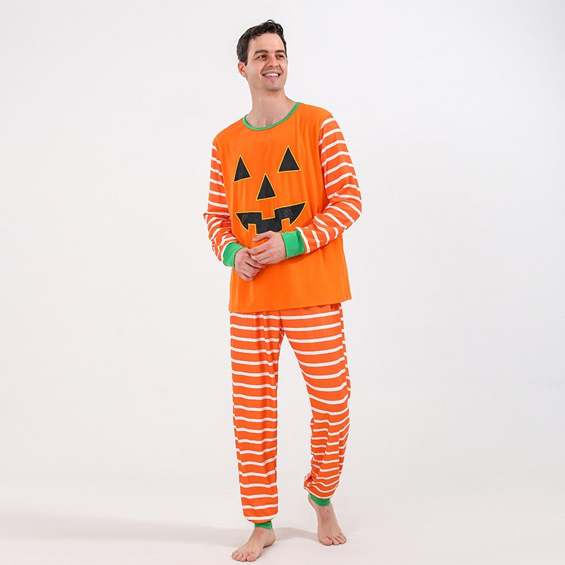 Kids halloween pajamas, black and orange striped with whimsical cartoon monster, soft cotton blend sleepwear