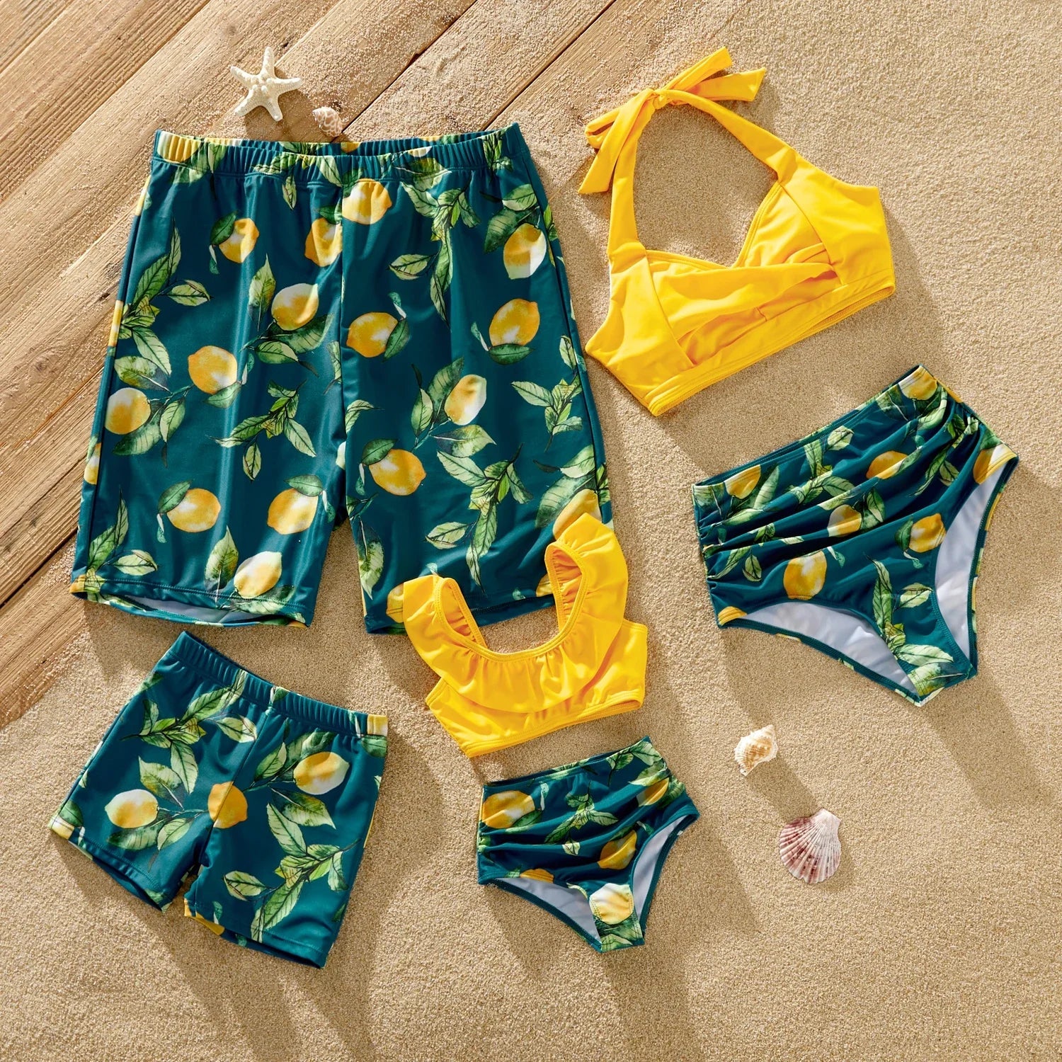 Family matching lemon print swimsuits, adults and kids, for beach vacation.