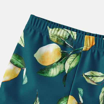 Toddler lemon print rash guard and swim shorts set for sun protection.