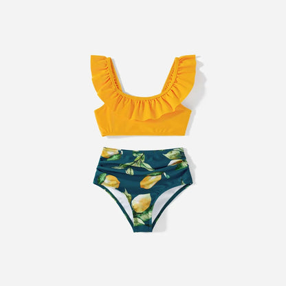 Vacation outfits: family matching lemon print swimwear for beach fun.