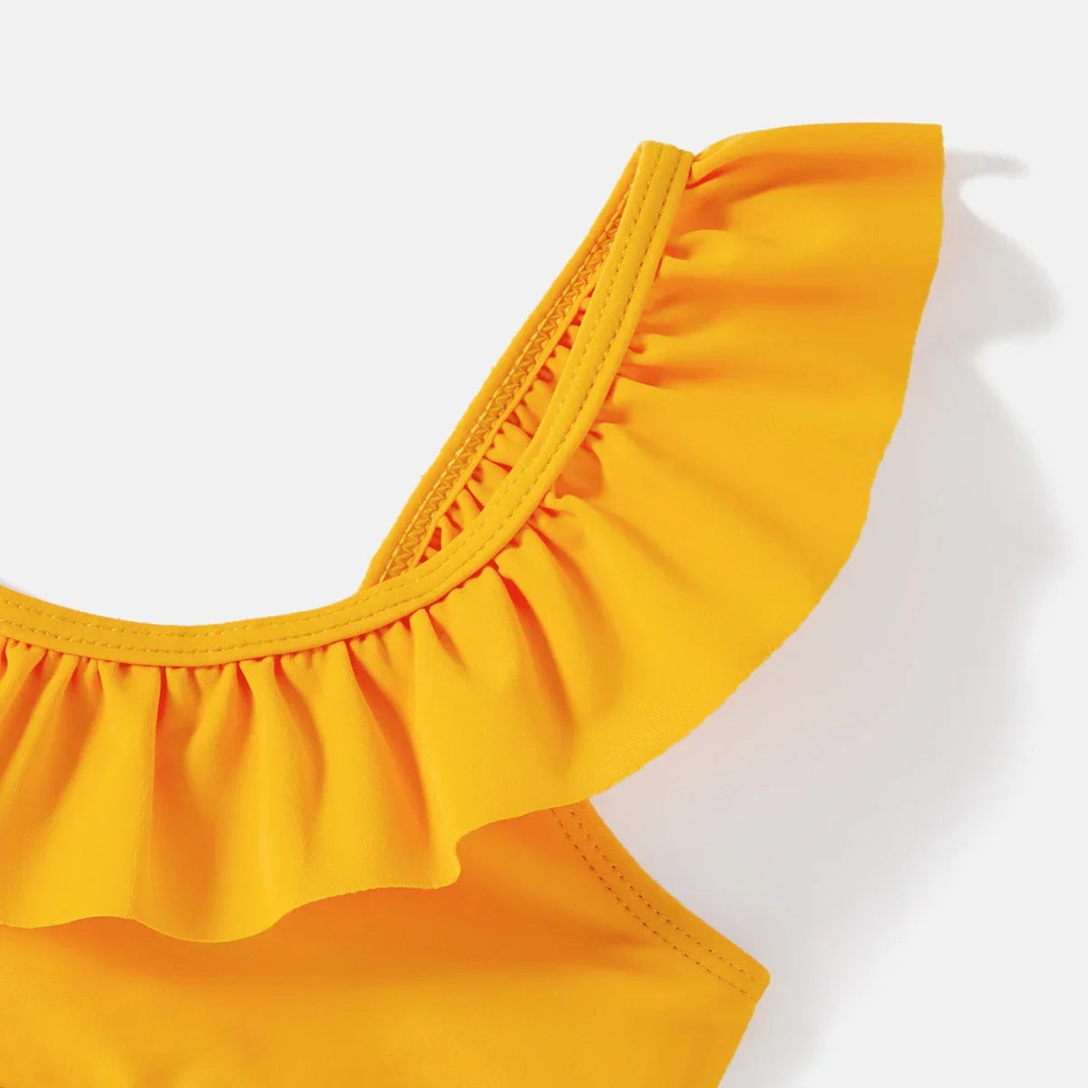 Unisex kids lemon print swim trunk, comfortable and playful pool attire.