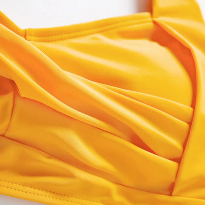 Family matching lemon print swimsuits in various styles, summer resort wear.
