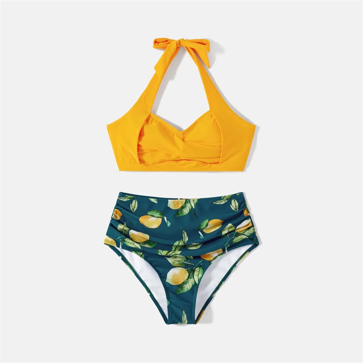 Dad and son matching lemon print swim shorts, ideal for beach wear.