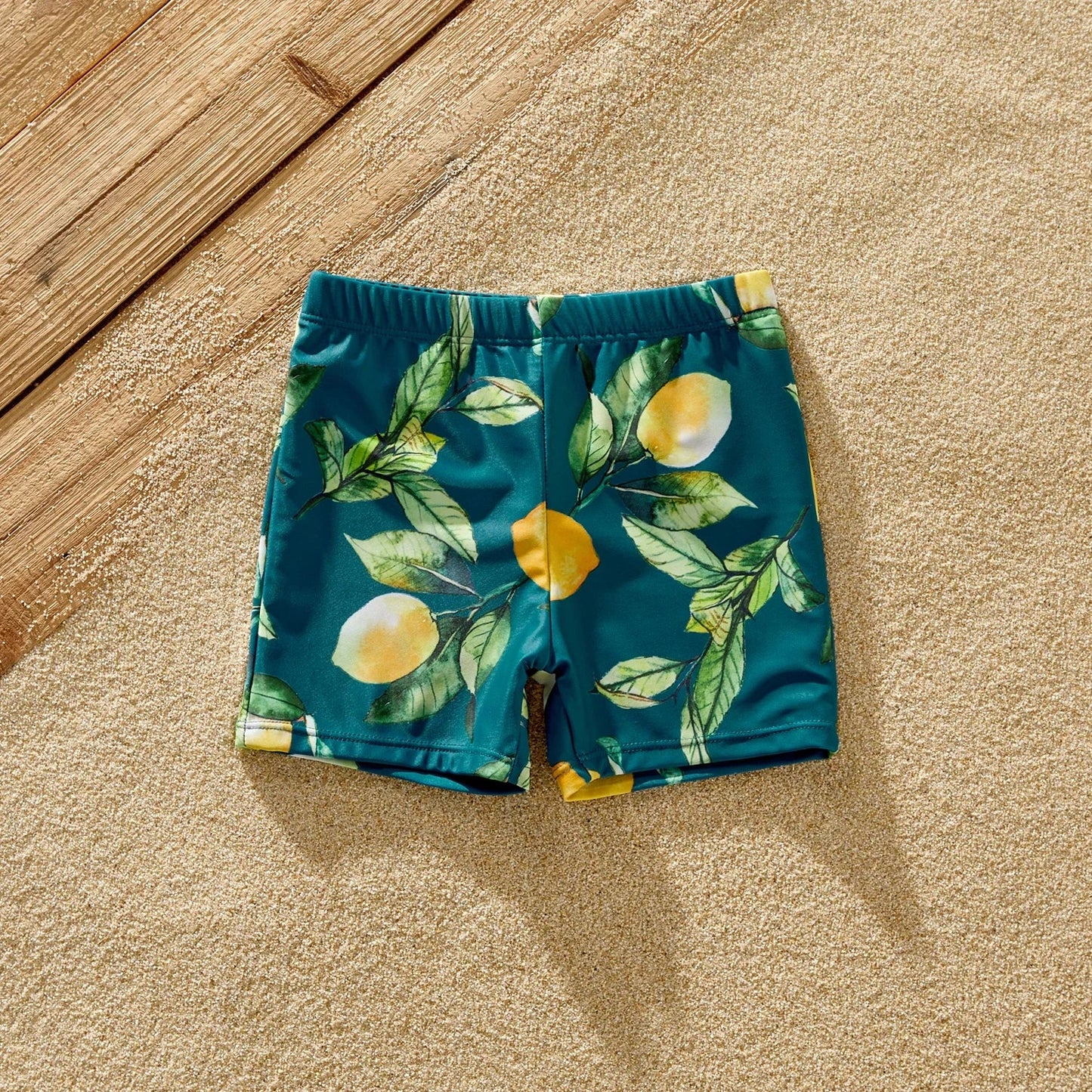Girls' lemon print one-piece swimsuit, perfect for kids' pool fun.