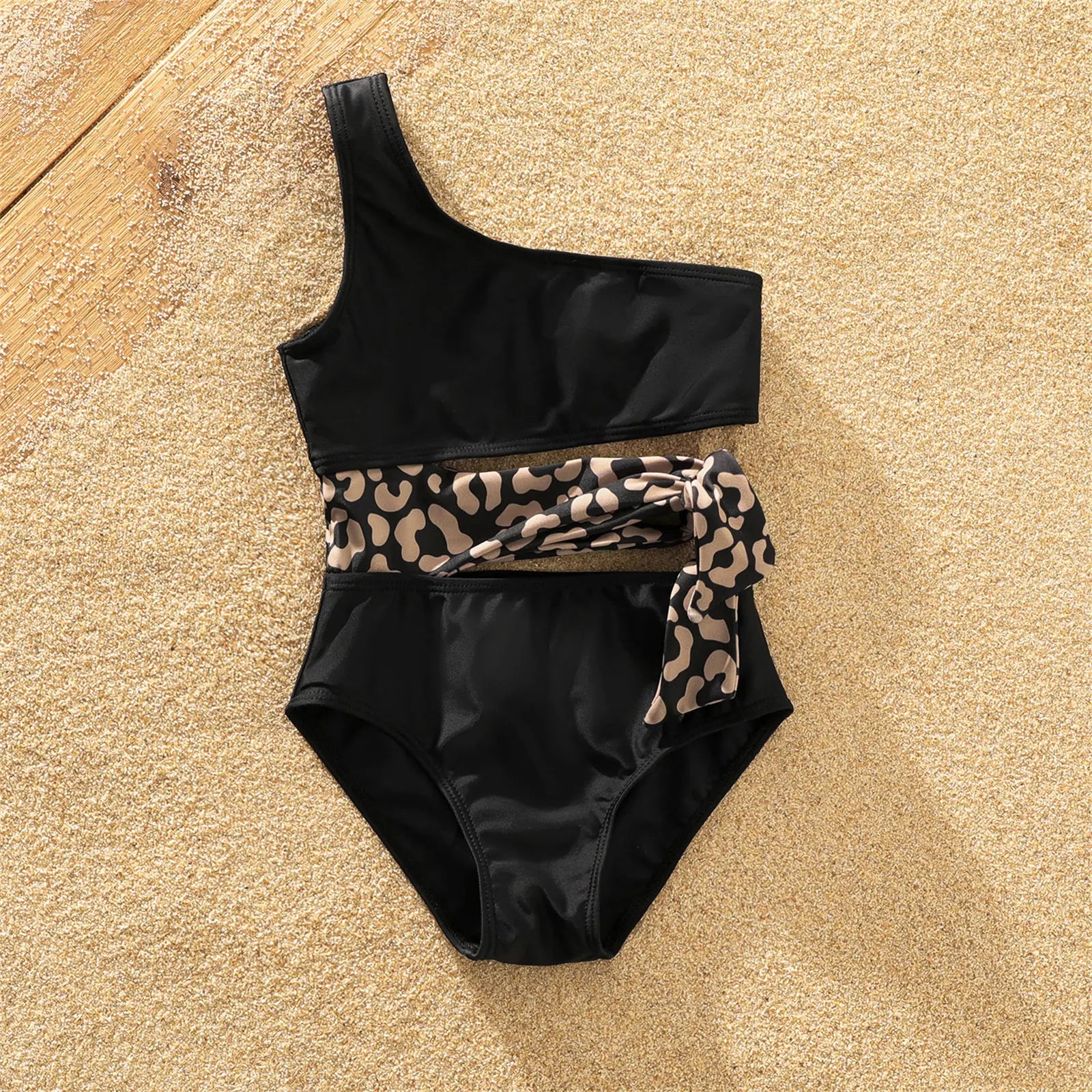 Mother and son in leopard print swimwear set, one-shoulder tie swimsuit and swim trunks
