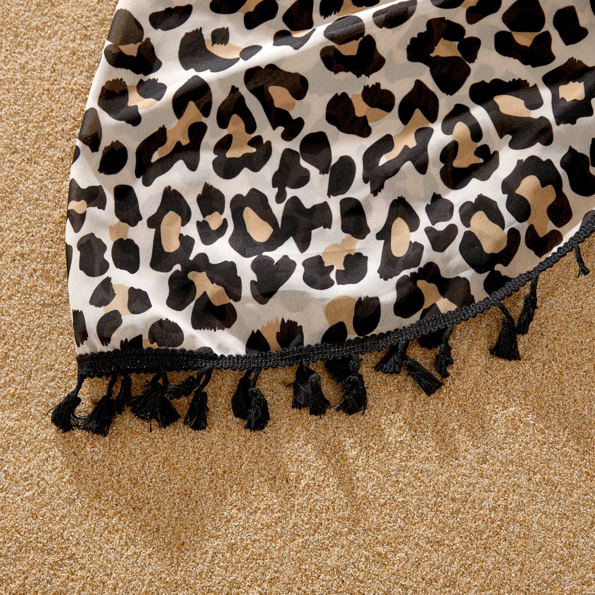 Coordinated leopard print family outfits, perfect for seaside relaxation