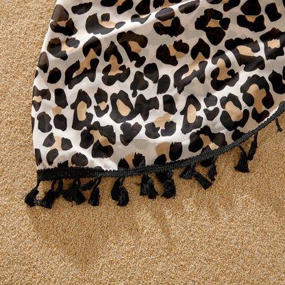 Coordinated leopard print family outfits, perfect for seaside relaxation