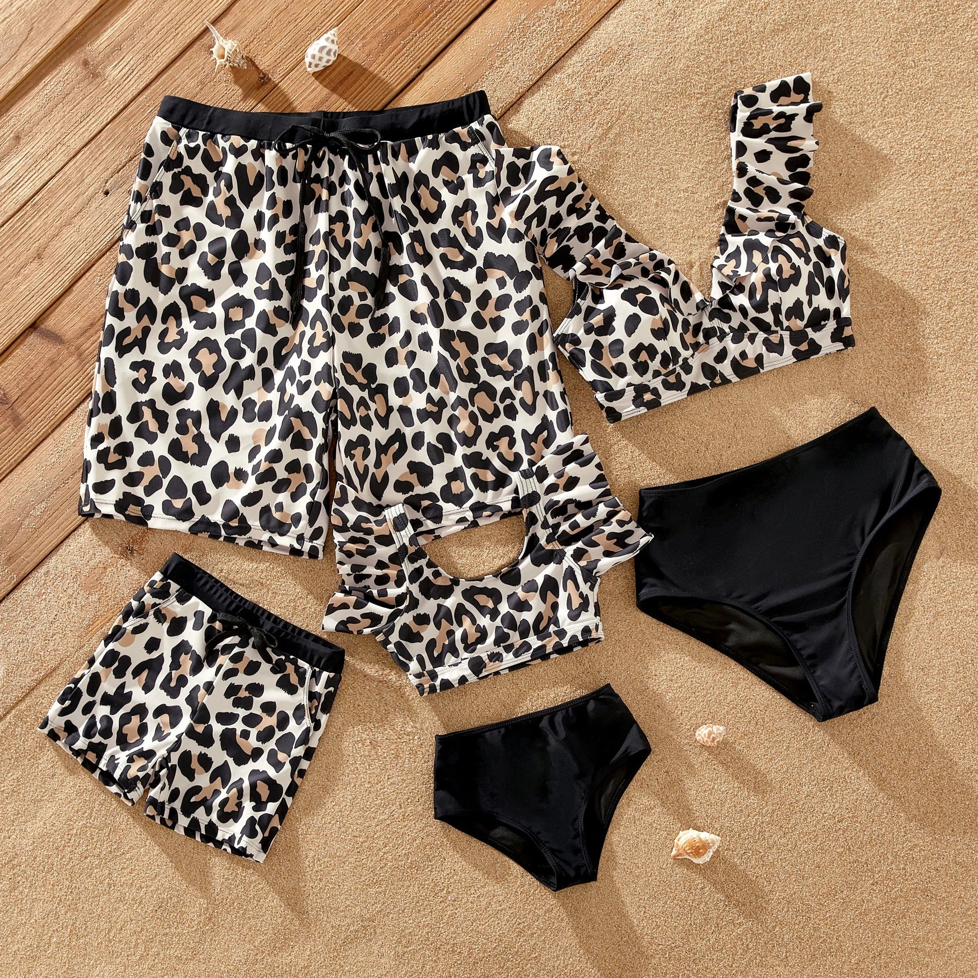 Men's leopard print swim trunks and matching women's bikini for family beachwear