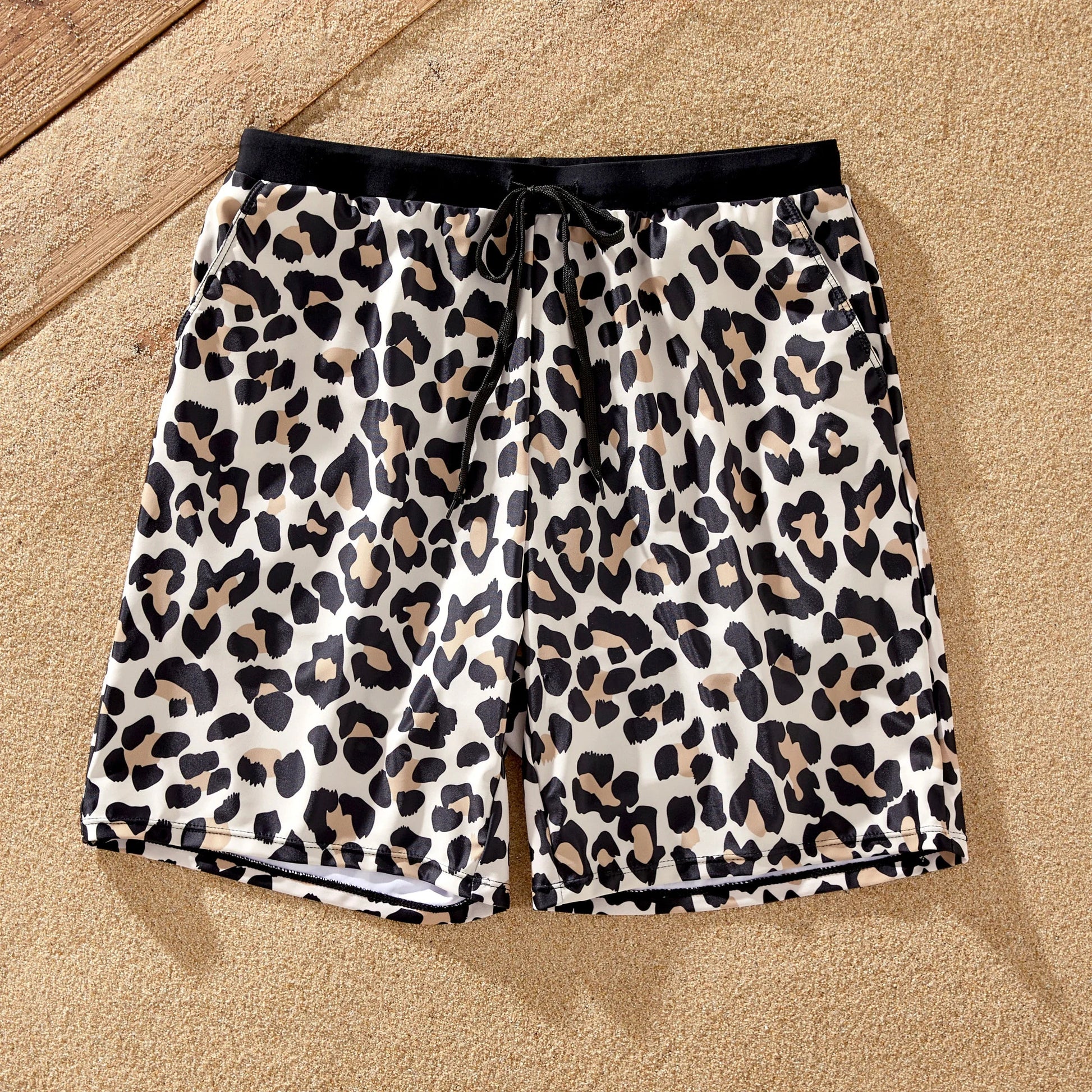 Family matching leopard print beachwear, ensuring everyone looks great by the water