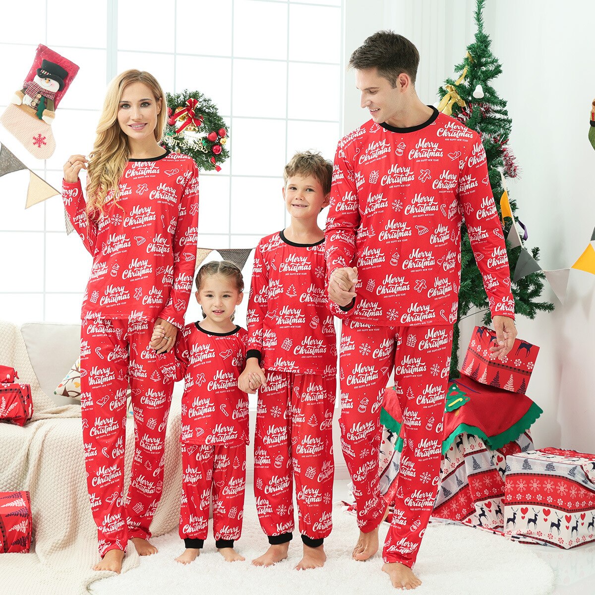 Parent and child in festive long sleeve matching Christmas tree pajamas, ideal for family photos