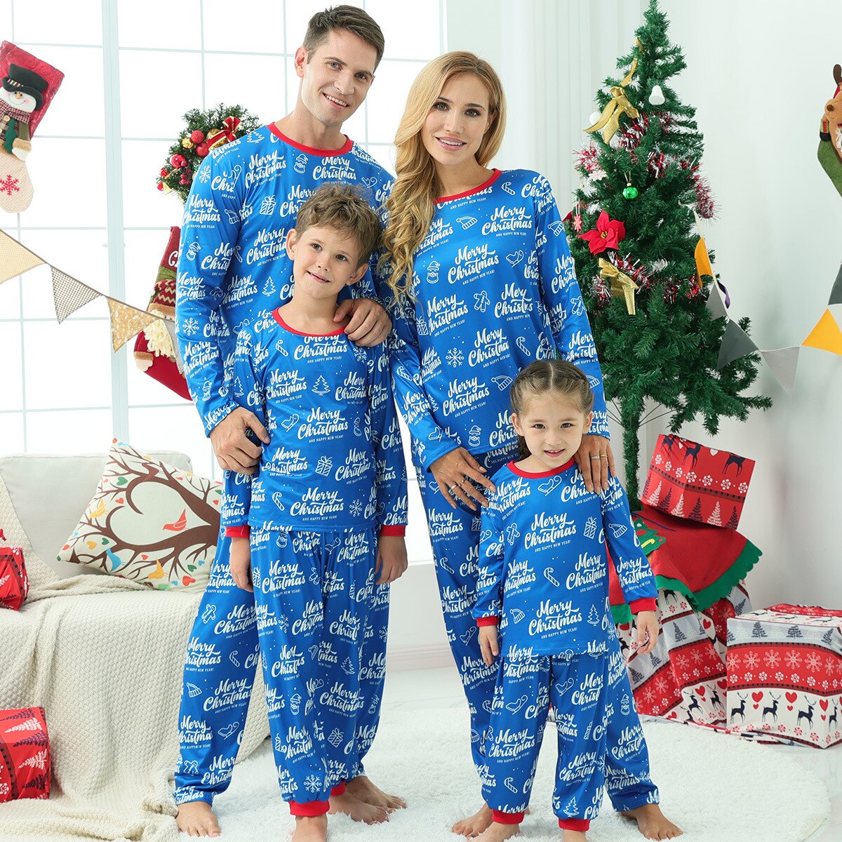 Baby in cute long sleeve Christmas pajamas with snowflakes, part of a family matching set, cozy nightwear