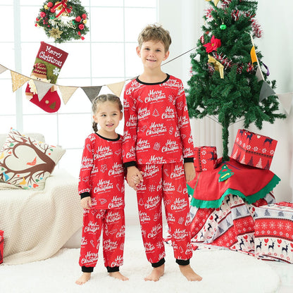 Full family wearing matching long sleeve red and white striped Christmas pajamas, festive holiday apparel