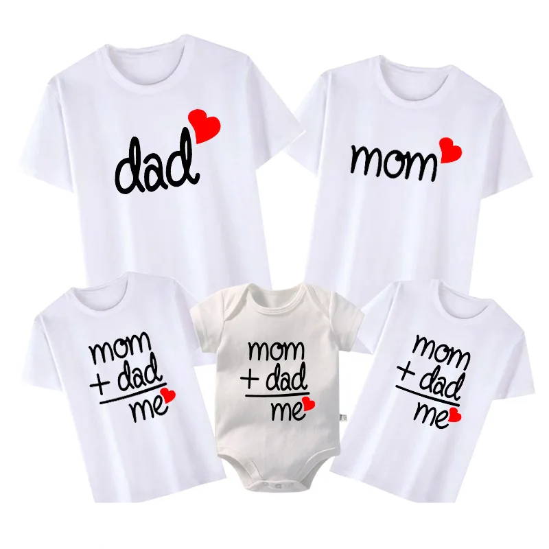 Unisex family matching outfits: parents & child wearing casual 'Love' tees for family photo.