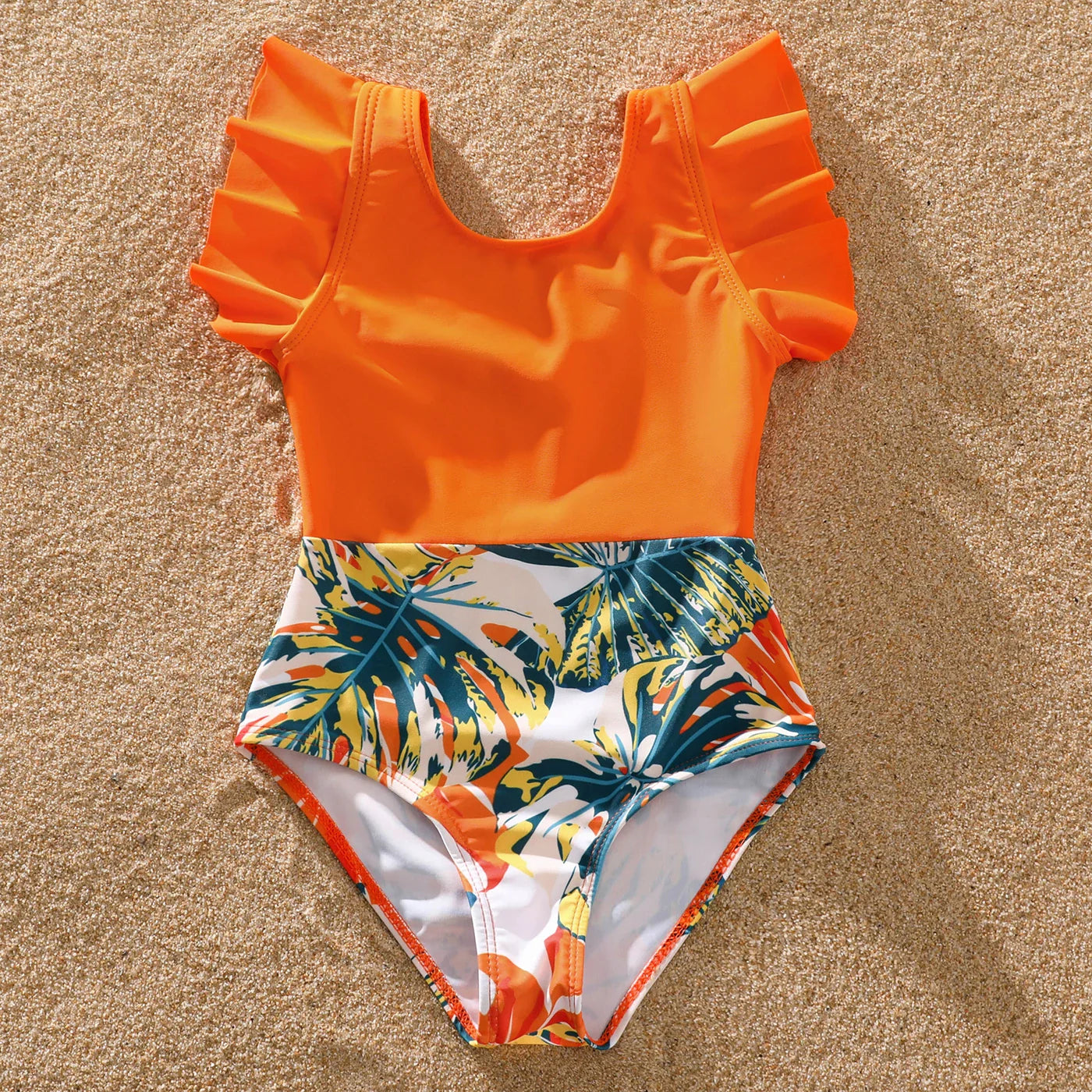 Elegant women's one-piece with orange tropical print, part of family set.