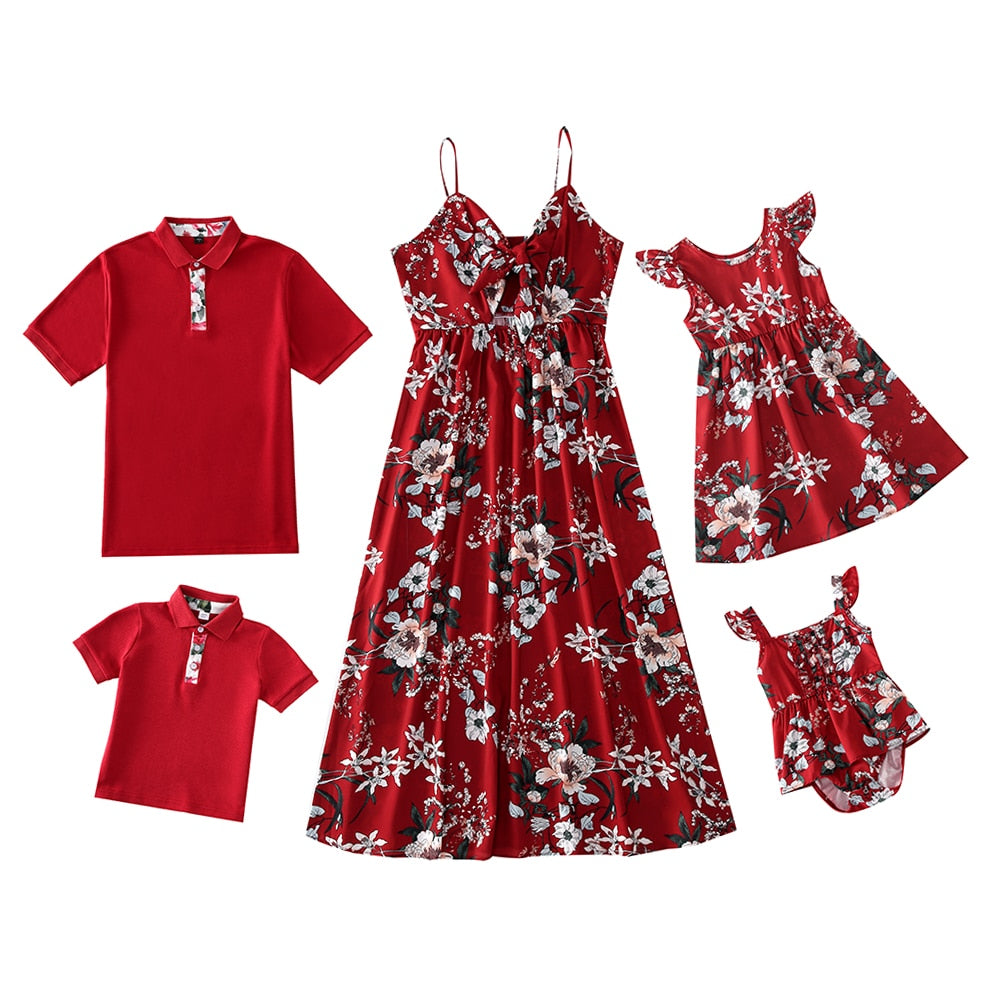 Coordinated family apparel: cheerful family of three in blue chiffon blend matching shirts and dresses.