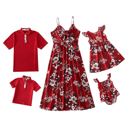 Coordinated family apparel: cheerful family of three in blue chiffon blend matching shirts and dresses.
