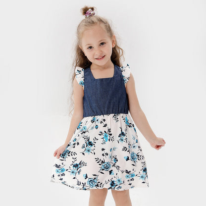 Family photo outfits: happy family in blue chiffon blend coordinated apparel for memorable pictures.