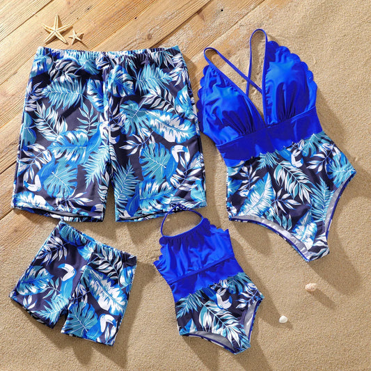 Family matching palm leaves print swimsuits for tropical beach vacation fun