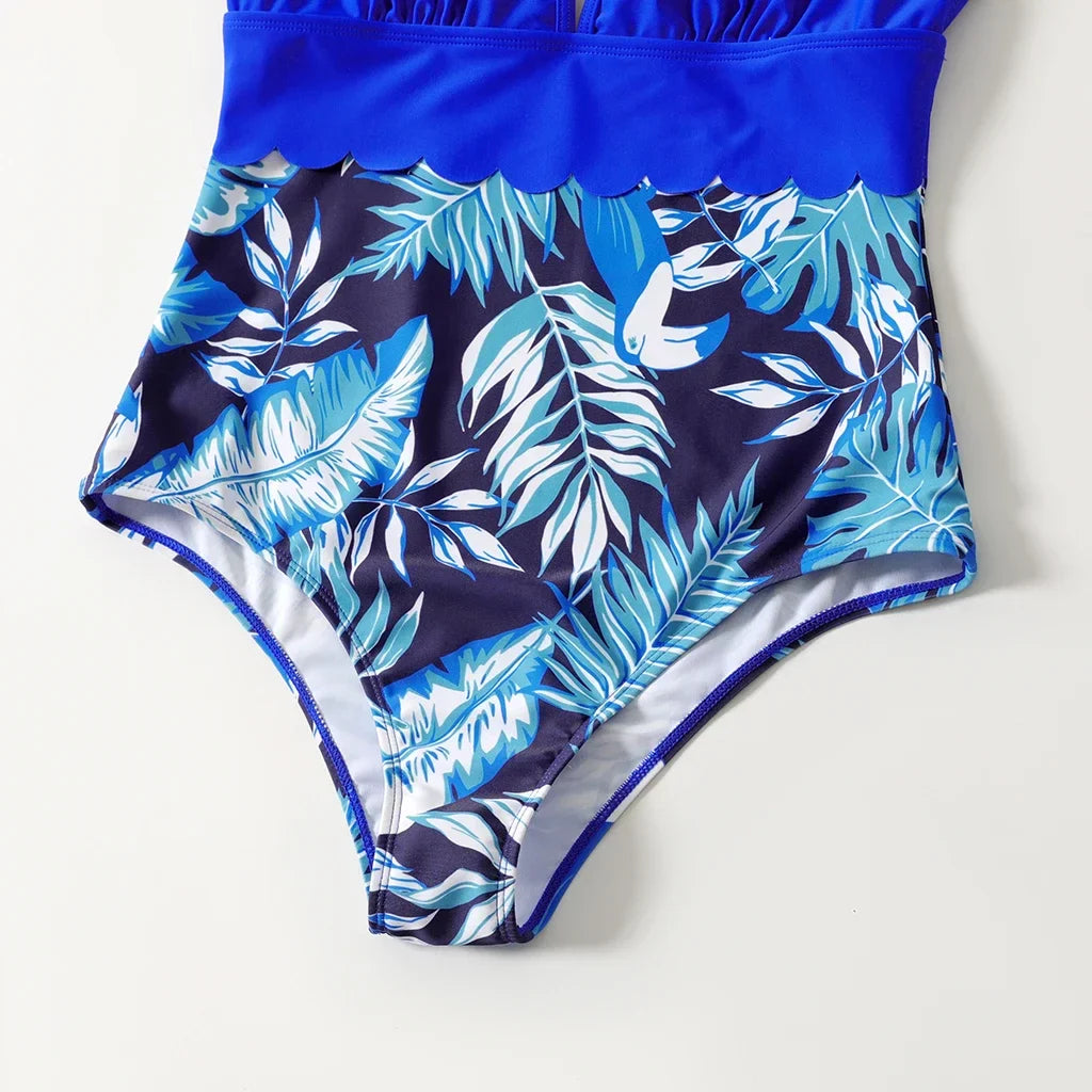 Matching tropical swimsuits with palm leaves pattern for family vacation wear