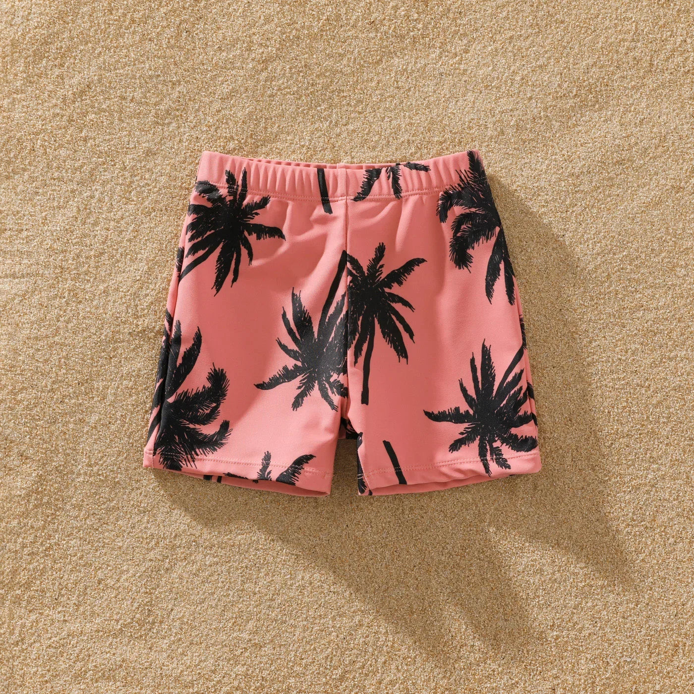 Matching pink swimwear for family, vibrant coconut tree print for summer outfits