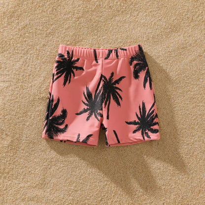 Matching pink swimwear for family, vibrant coconut tree print for summer outfits