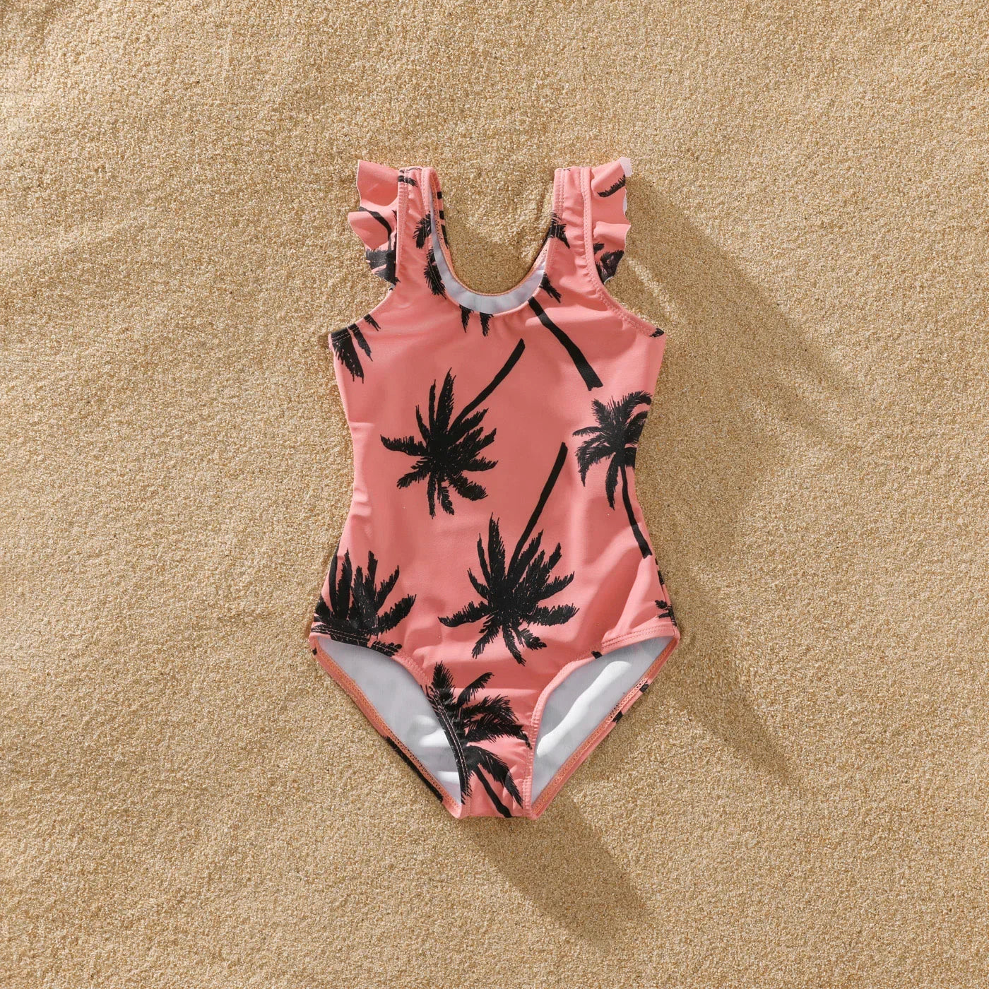 Dad and son matching pink swim shorts with coconut tree print, summer swimwear