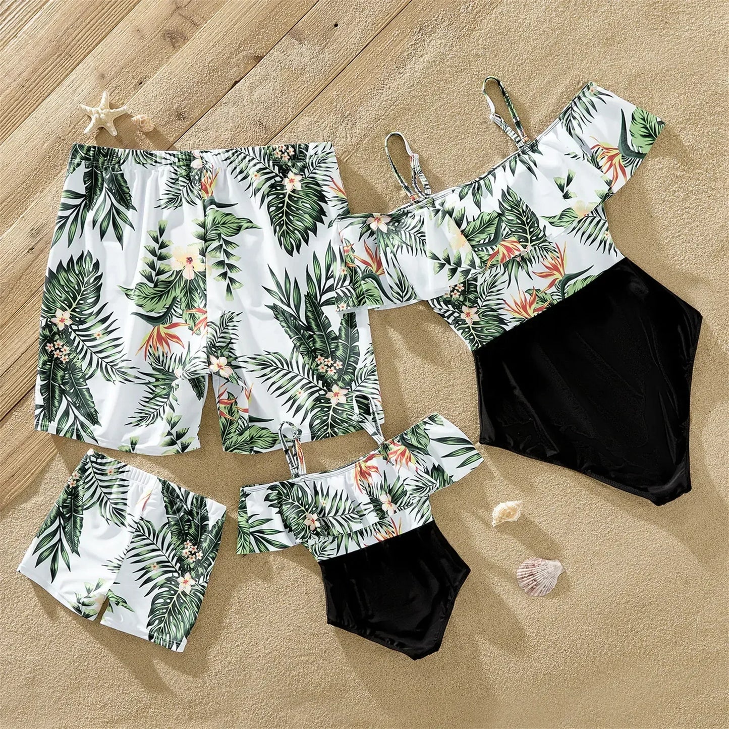 Close-up of a vibrant green plant print one-piece swimsuit, ideal for women's tropical beachwear